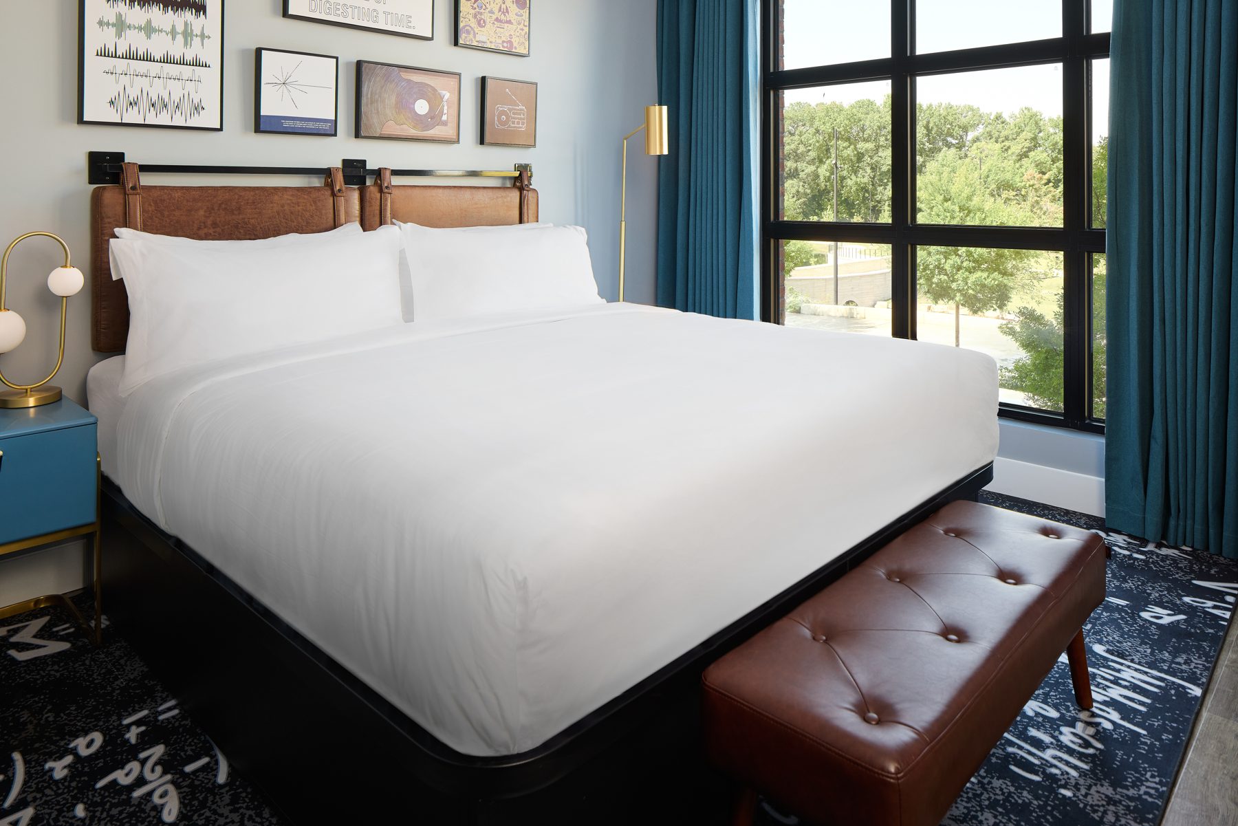 King room with leather bench and big windows