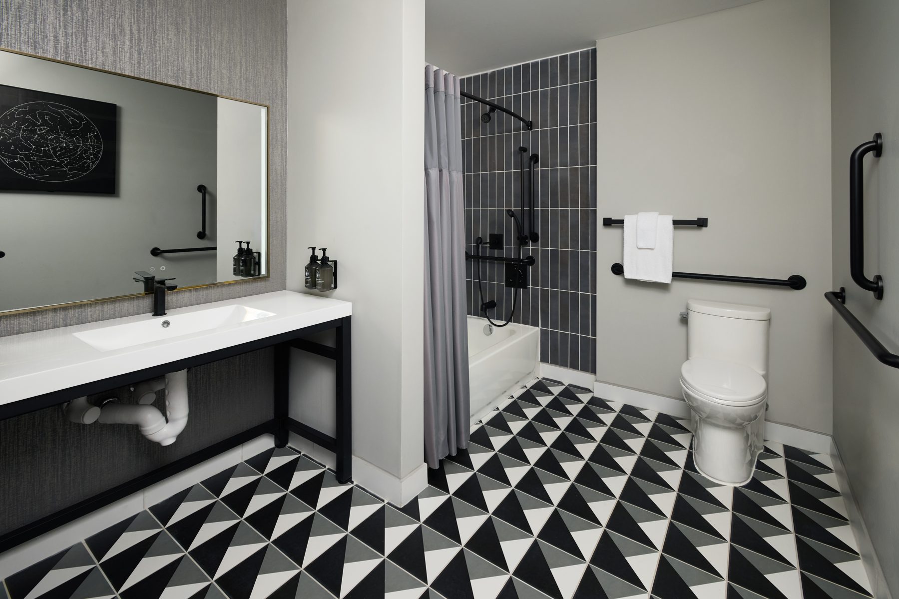 Bathroom with black and white geometric tile
